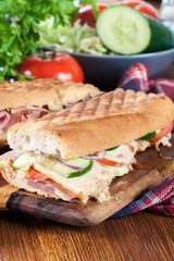 Toasted sandwiches with ham, cheese and vegetables