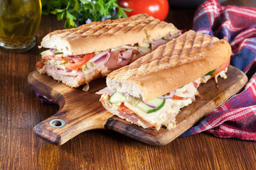 Toasted sandwiches with ham, cheese and vegetables