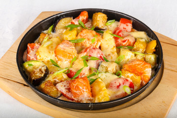 Baked salmon with potato in pan