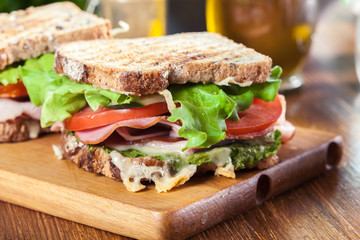 Sandwiches with ham, cheese, tomatoes, lettuce and cucumber