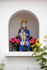 Statue of St. Mary and Child Jesus in a street chapel in Bialystok, Poland