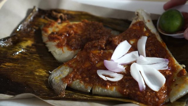 Singaporean, Malaysian food grilled stingray sambal sauce serve on banana leave