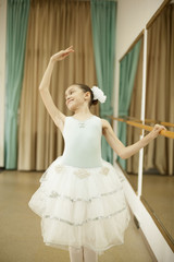 Fototapeta premium Little ballerina in ballet studio