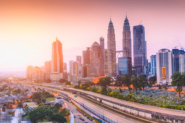 Landscape of Kuala Lumpur skyscraper with colorful sunrise sky, Malaysia..