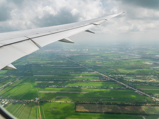 The top view from a window of the flying plane, background for travel holiday trip summer.