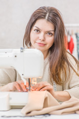 seamstress work on the sewing machine. Hobby sewing as a small business concept
