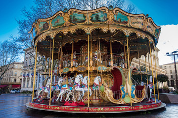 French old-fashioned style carousel with stairs at Place de l'Horloge in Avignon France © anamejia18