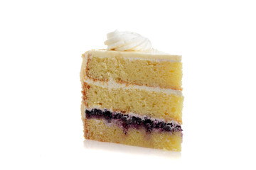 closeup slice blueberry cream cake with frosting swirl