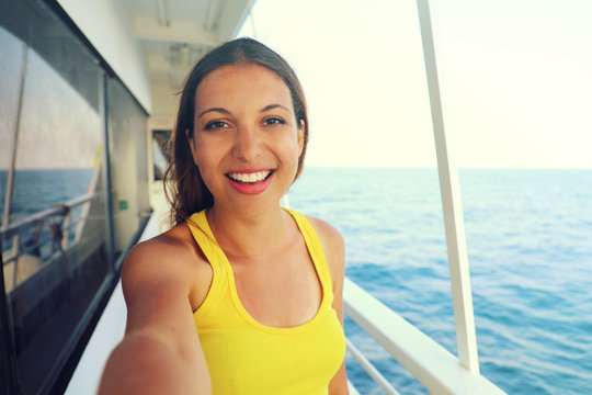 Selfie photo of young model woman on luxury travel cruise vacation in yellow dress enjoying the evening on Amalfi Coast getaway holidays. Happy traveler vacations in Italy. Vintage filter. Copy space.