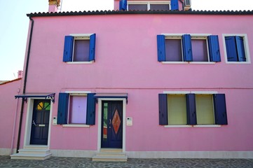 Street with colorful buildings and houses in Burano island, Venice, Italy - Famous Architecture and landmarks