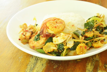 spicy fried prawn and squid with herb on rice