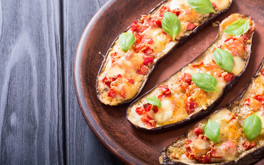 Eggplant with tomatoes , cheese and basil