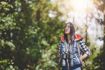 Fototapeta na wymiar Hiking concept, Happy female tourist to travel in wild trip hiking during vacation.