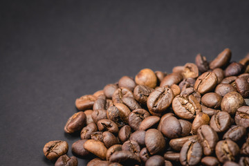 Close up of coffee beans are the background.