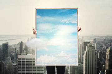 picture frame with sky and city