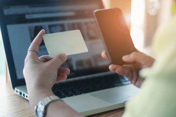 Online Shopping Website on Laptop. Easy E-commerce Website Shop by Smartphone, and Laptop.