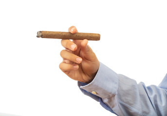 Cuban cigar in a male hand isolated on white background, clipping path