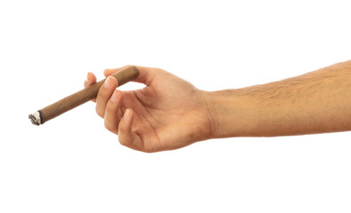 Cuban cigar in a male hand isolated on white background, clipping path