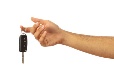 Hand holding a car key isolated on white background, clipping path