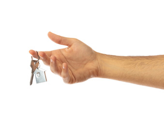 Hand holding a house key isolated on white background, clipping path