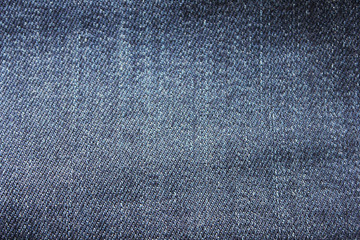 Jean Denim  Texture Background of Dark Blue Natural Pattern. Fabric Material of Classic Vintage Clothes with Diagonal Lines and Stitches. Casual Stylish Urban Cloth Background or Backdrop Template.