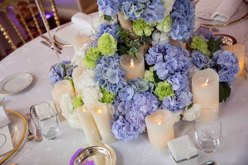 Flowers and candles on table