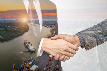 Double Exposure of a businessman handshake on the container,container ship in import export and business logistic,By crane ,Trade Port , Shipping,cargo to harbor background.
