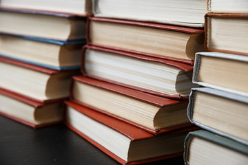 Stack of books background. many books piles.