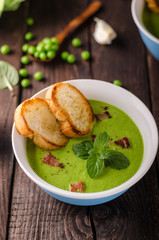 Pea soup, fresh herbs and bacon