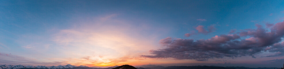 Naklejka na ściany i meble Sunset sky above mountains