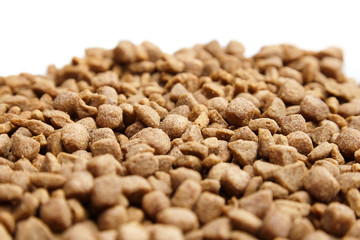 Dry food for dogs and cats. Pet meal on white background. Selective focus