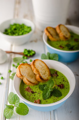 Pea soup, fresh herbs and bacon