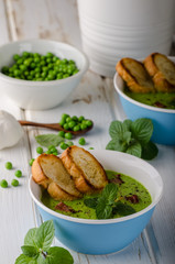 Pea soup, fresh herbs and bacon