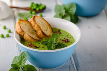Pea soup, fresh herbs and bacon