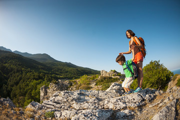 A woman is traveling with a child.