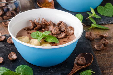 Chocolate pudding, banana and herbs in