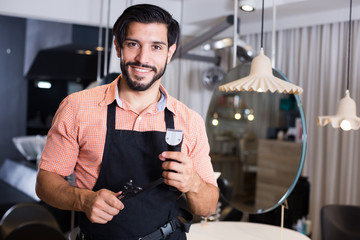 professional man hairdresser in salon