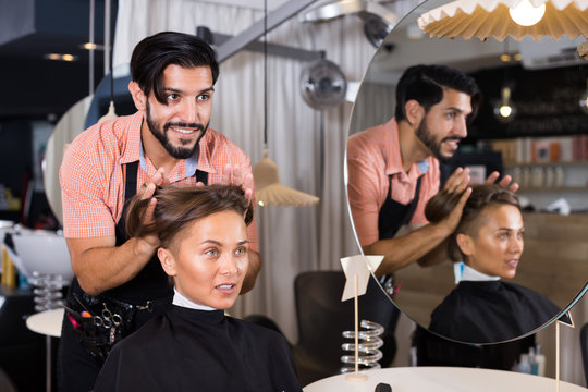 hairdresser working with woman hair