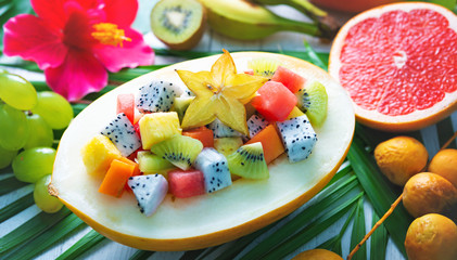 Exotic tropical fruits salad served in half a melon