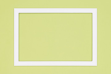 Abstract flat lay pastel green colored paper texture minimalism background. Minimal template with empty picture frame mock up.