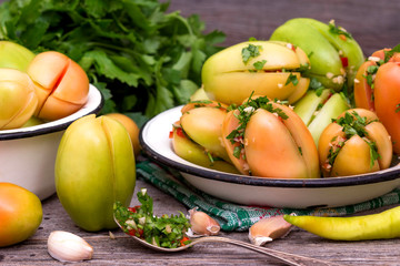 Green tomatoes stuffed with pepper and herbs.