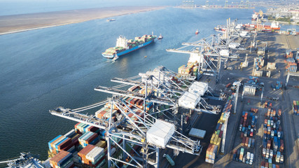 Busy industrial port with cargo ship