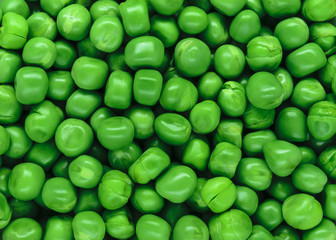 Clear and sharp close up view of fresh green peas background surface