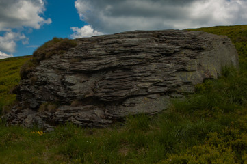 old dark gray rock on top of one of the Carpathian mountains