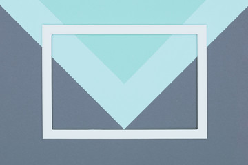 Abstract geometrical pastel blue, turquoise and grey colored paper flat lay background. Minimalism,...
