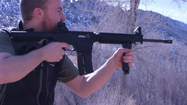 Man firing an AR-15 Assault rifle. 