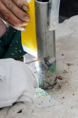 welds of a railing during the renovation of a roof in the evening in Italy