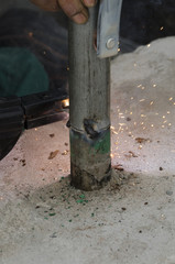 welds of a railing during the renovation of a roof in the evening in Italy