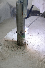 welds of a railing during the renovation of a roof in the evening in Italy