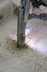 welds of a railing during the renovation of a roof in the evening in Italy